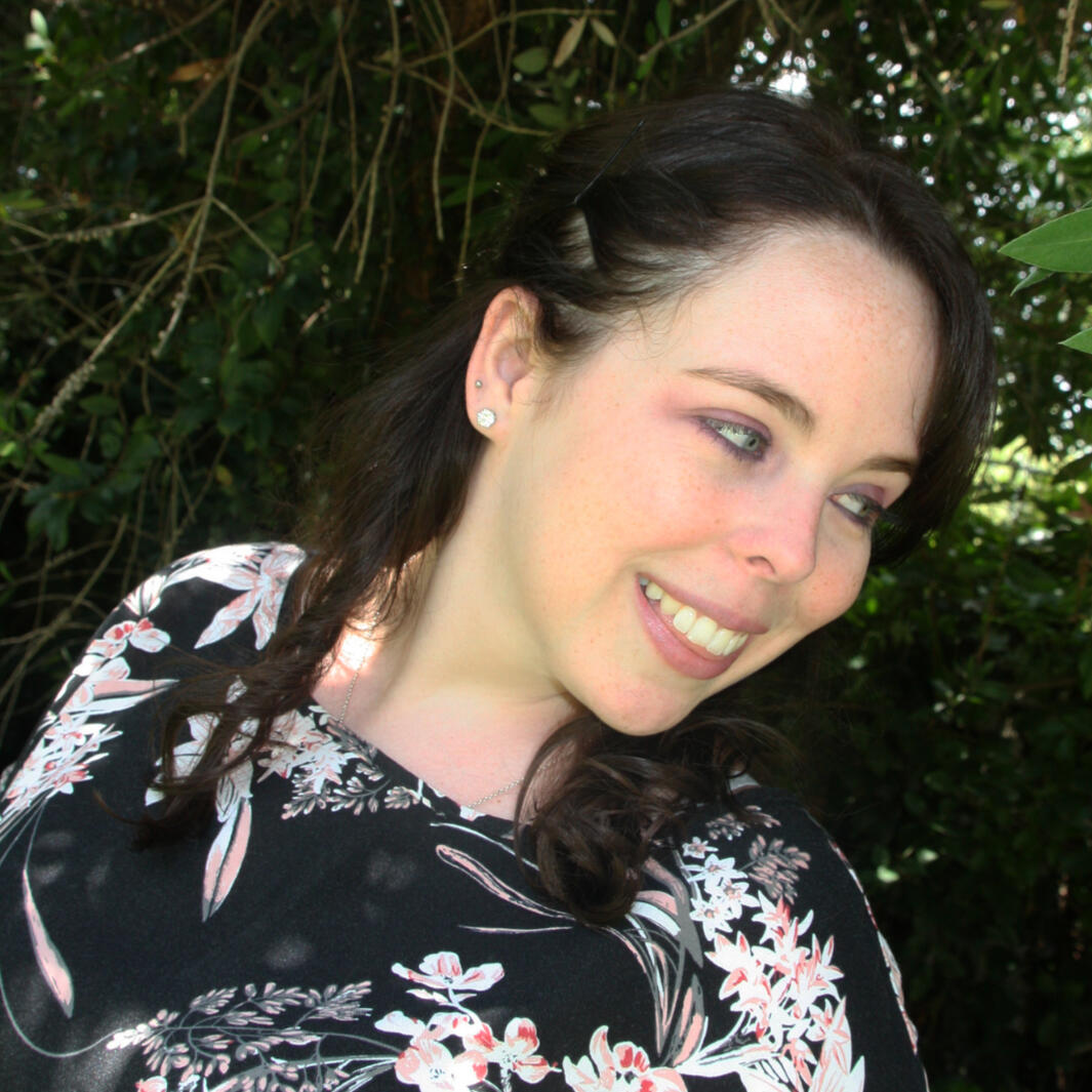 headshot of Nicole looking off to the side